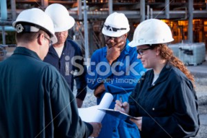stock-photo-19308480-workers-at-manufacturing-plant